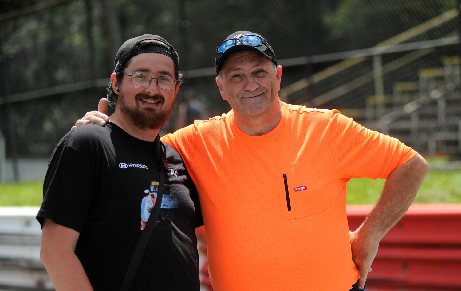 Movers and shakers: Track photographer William Smith and car show announcer Ric Ryder.